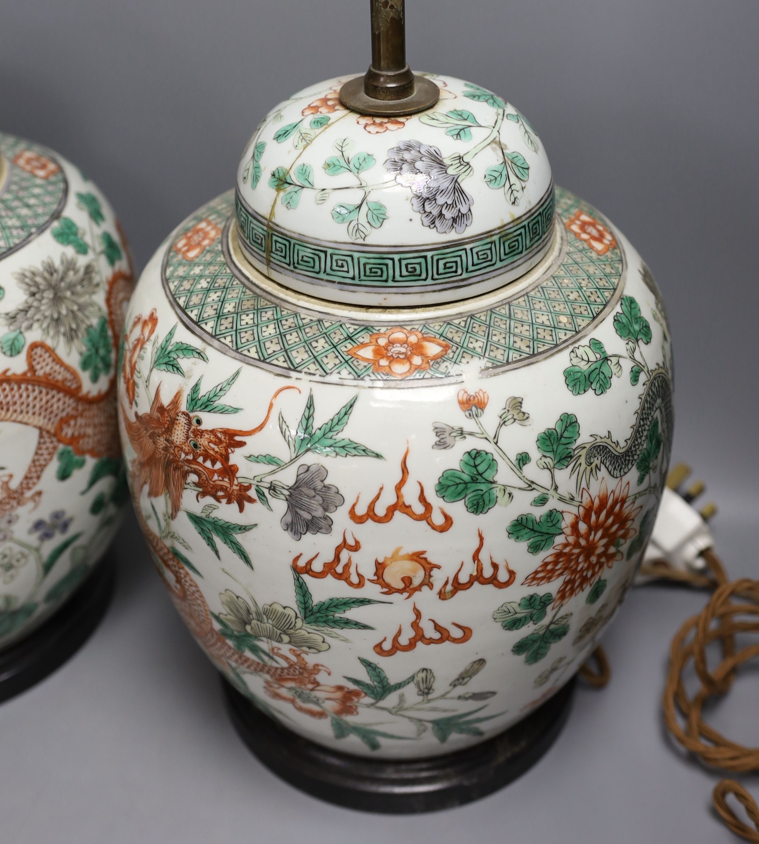 A pair of 19th century Chinese famille verte’dragon’ jars and covers (drilled and converted to lamps) - 53cm high